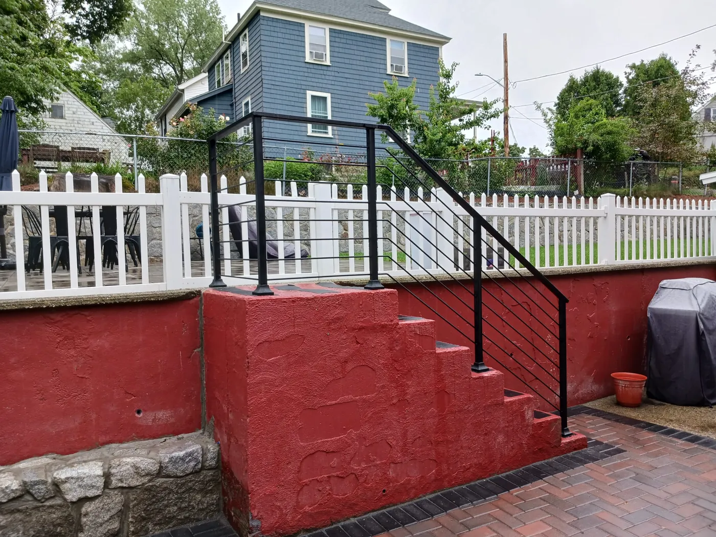 Black railing on painted patio steps